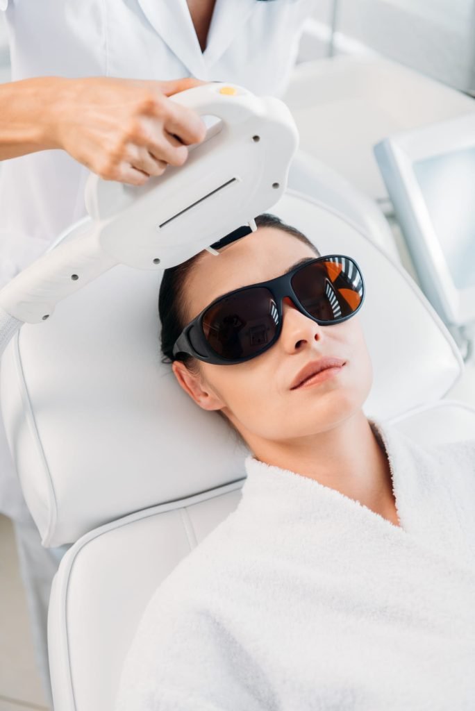 Woman receiving laser hair removal